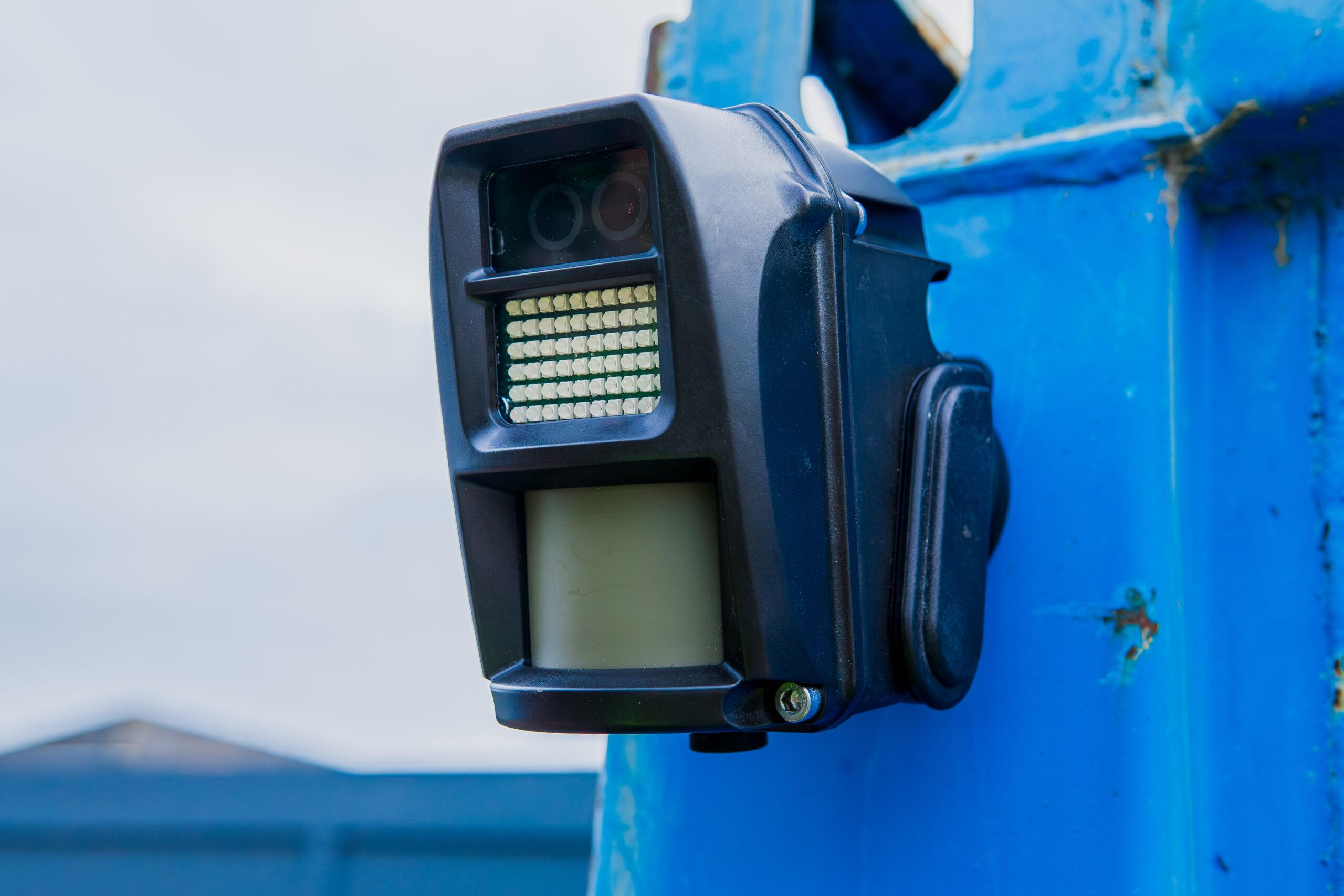 close up on wireless alarms attached to building