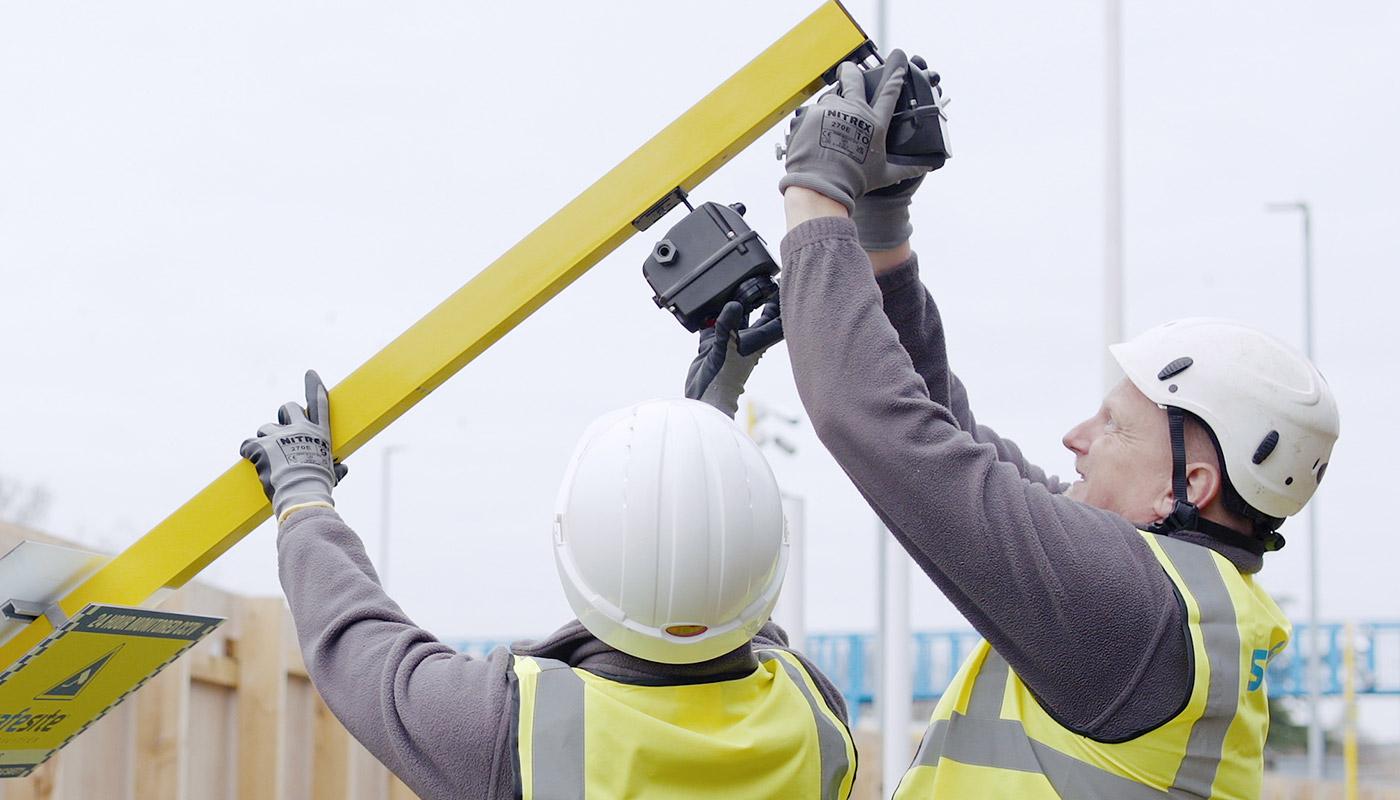 wireless alarms being installed on high visibility pole