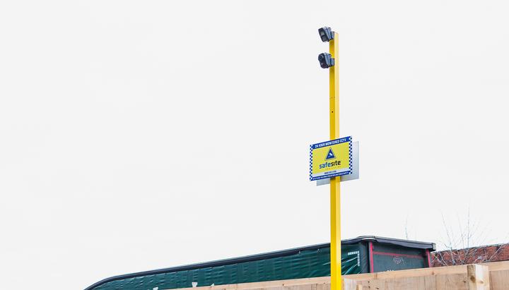 wireless alarms and high visibility signage attached on pole